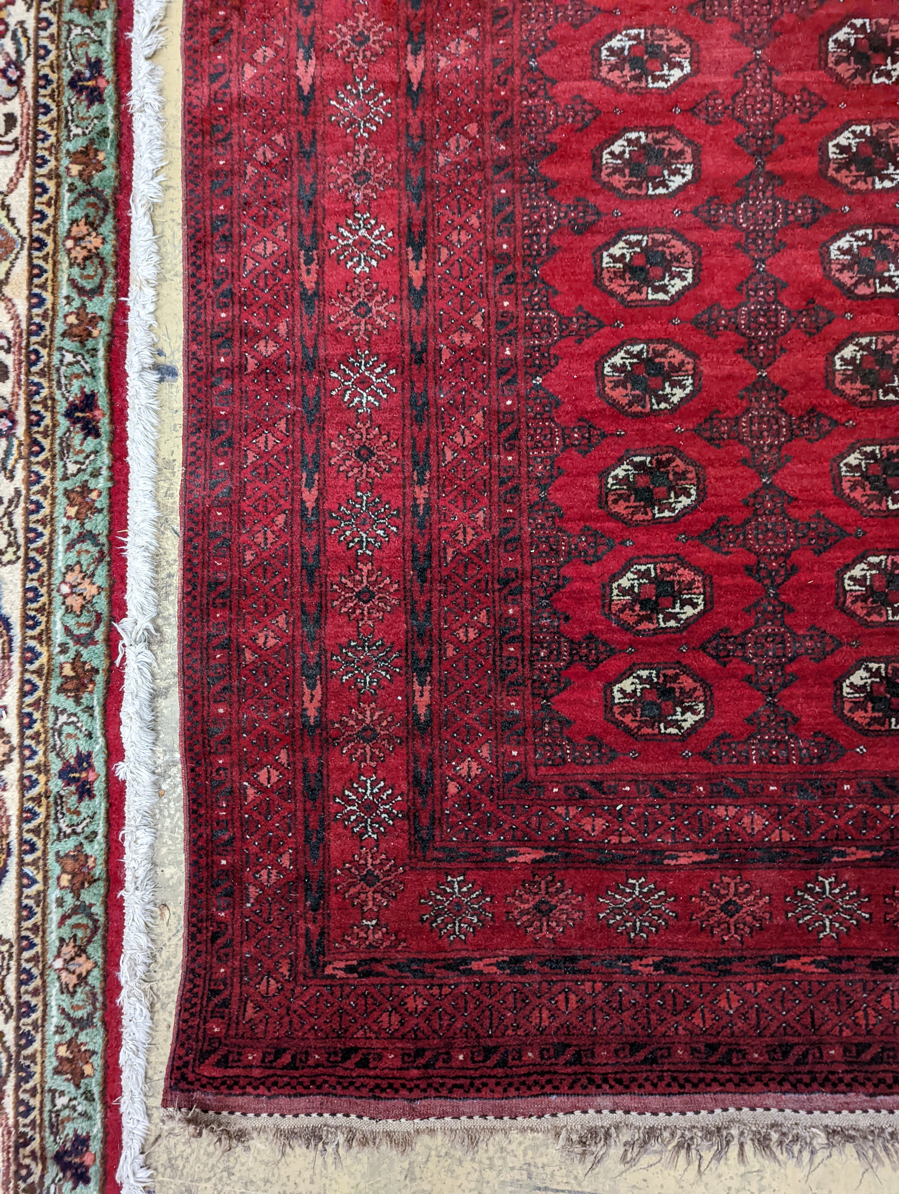 A Bokhara burgundy ground rug, 190 x 130cm